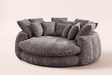 Aosta oversized round lounge chair in grey chenille, three-quarter view on a warm cream studio backdrop