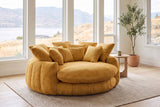 Aosta lounge chair in a Kelowna lake-house living room in the morning, the lake and dry hills beyond the windows (Yellow)