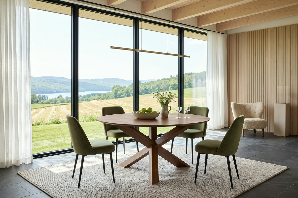 Apecchio round dining table in an Eastern Townships hilltop house, with pale oak slats