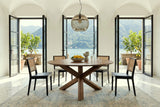 Apecchio round dining table in a Lake Como villa, with white plaster vaults