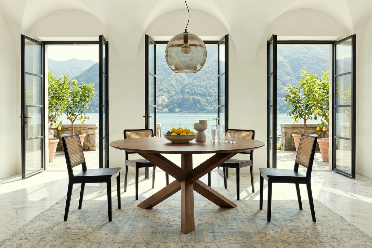 Apecchio round dining table in a Lake Como villa, with white plaster vaults