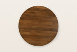 The round Apecchio top seen from above in walnut and teak, the mango planks running one way across it
