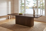 Aquileia dining table in a whitewashed Muskoka cottage dining room with a window onto the lake, a bowl of green apples on top
