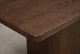 Close-up of the Aquileia tabletop corner: a thick edge, a soft rounded corner and open wood grain