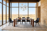 Arcevia dining table in Brown in a Saskatchewan prairie house with a rammed-earth wall and a tall glass wall to the hills