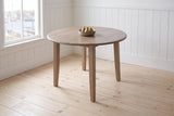 Arden drop-leaf dining table in Walnut with a bowl of pears, in the panelled breakfast corner of a Lunenburg, Nova Scotia house, the harbour through the window