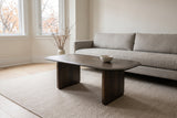 Arquata coffee table in mocha in front of a stone-grey linen sofa in a bright Rosedale, Toronto living room, a small white bowl on the top