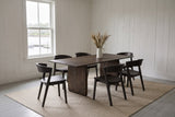 Arquata 7-piece dining set in mocha on an oatmeal rug in a Lunenburg sea captain's house, white board walls and the harbour through the sash window