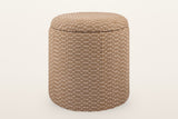 Arvier round storage pouf in Camel, three-quarter view on a warm white studio backdrop: a jute and cotton weave drum with a padded lid