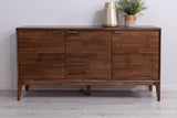 Ashby acacia 3-door sideboard in Natural Brown against a pale wall with a brass vase