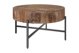 Ashford round coffee table with a solid mango wood drum top and black iron X-base, three-quarter view