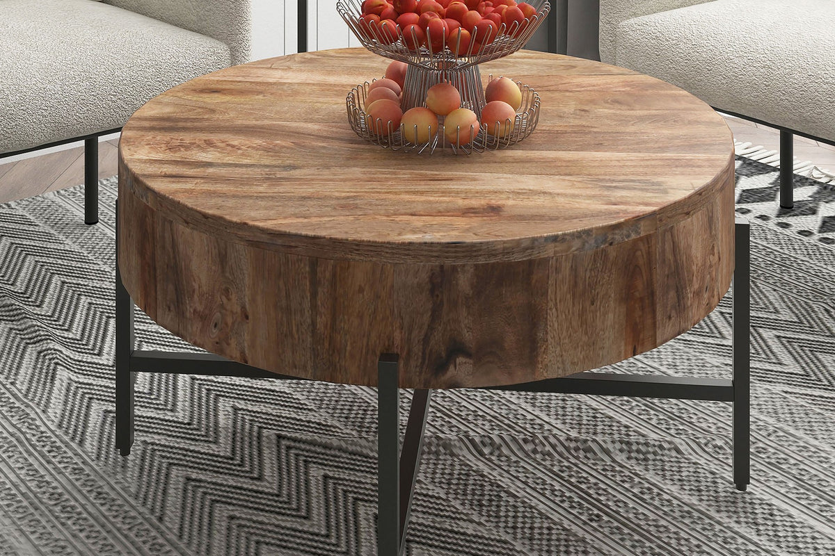 Ashford mango wood coffee table with a fruit bowl between cream armchairs on a patterned rug
