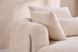 Close-up of the Beige chenille on the Asolo arm, its side pocket and the pillows