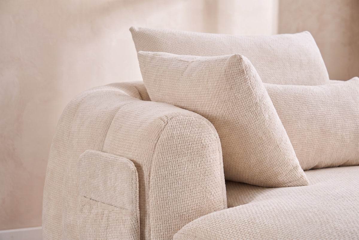 Close-up of the Beige chenille on the Asolo arm, its side pocket and the pillows