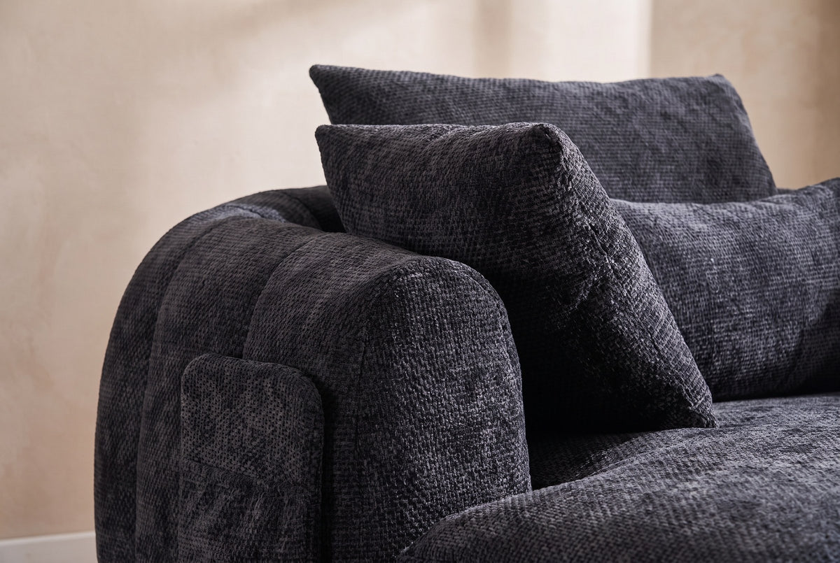 Close-up of the Black chenille on the Asolo arm, its side pocket and the pillows