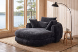Asolo chaise lounge in the reading corner of a Muskoka cottage, by a window onto the lake