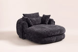 Asolo chenille chaise lounge chair in Black, three-quarter view on a warm cream studio backdrop