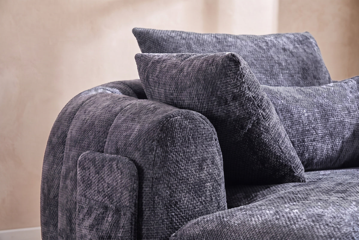 Close-up of the Grey chenille on the Asolo arm, its side pocket and the pillows