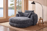 Asolo chaise lounge in Grey chenille in the reading corner of a Muskoka cottage, by a window onto the lake
