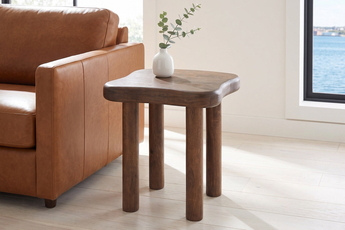 Atri side table in dark walnut beside a cognac leather sofa in a bright Halifax living room by the harbour
