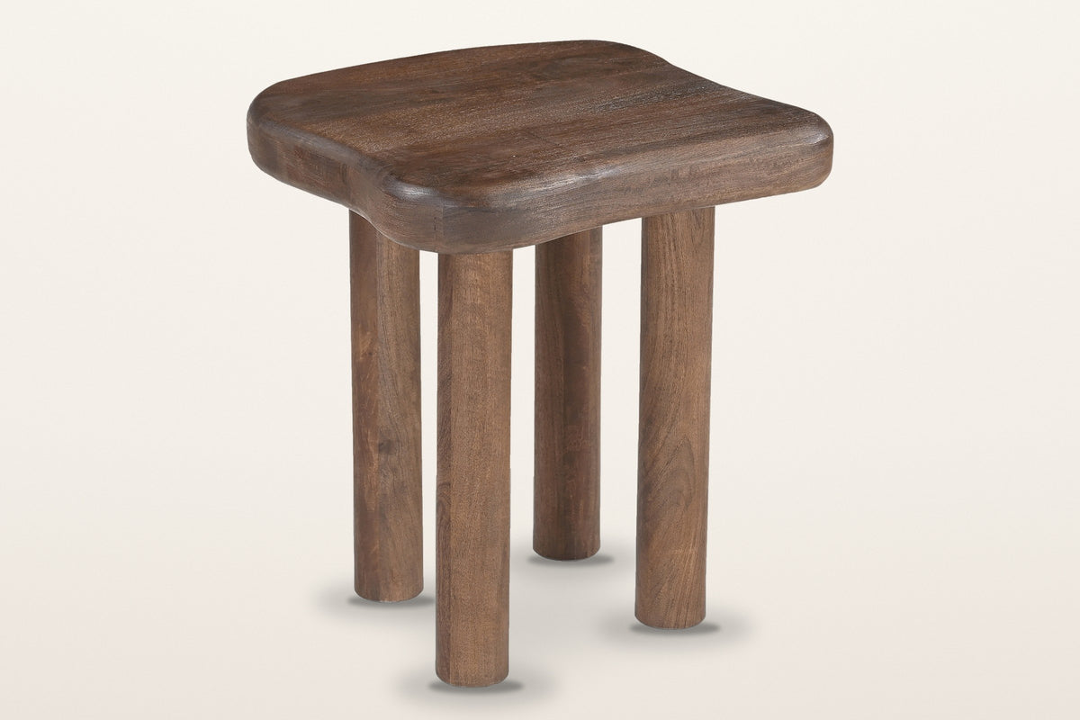 Atri freeform mango wood side table in dark walnut, three-quarter view on a warm white studio backdrop