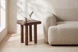 Atri side table in dark walnut beside an oatmeal linen sofa in a Vancouver living room
