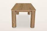 Atzara dining table in Natural from one end, a little above