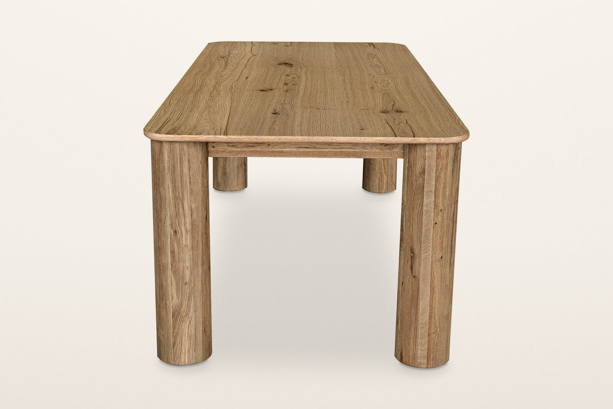 Atzara dining table in Natural from one end, a little above
