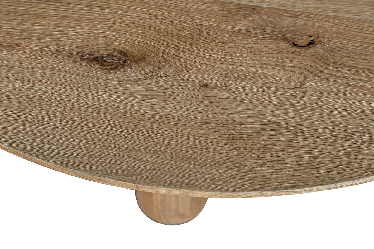 Close-up of the thin round Atzara edge: the bevelled underside and the top of a column below it
