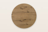 The round Atzara top seen from above in Natural: oak planks running one way, with knots and a row of small checks