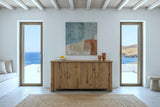 Atzara sideboard in Natural against a white plaster wall in a house on Naxos, under a cane ceiling with white beams