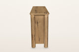Atzara sideboard in Natural, end view on a warm white studio backdrop: a flat oak end panel between two round column posts