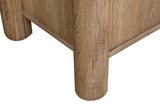 Close-up of two round column posts of the Atzara Small sideboard in Natural, standing on flat feet below the case