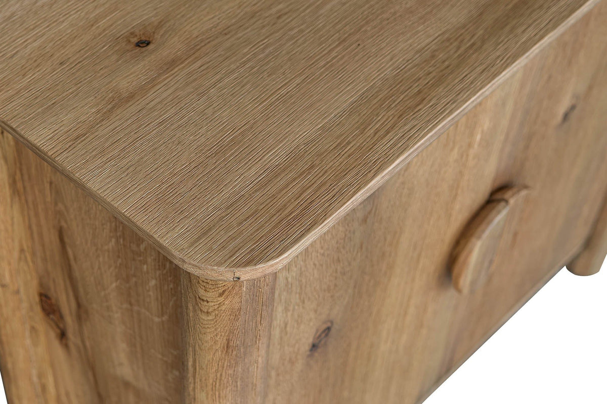 Close-up of a rounded corner of the Atzara Small top in Natural, with knots in the oak grain
