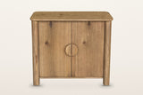 Atzara Small sideboard in Natural, straight front view on a warm white studio backdrop: two doors meeting at the centre