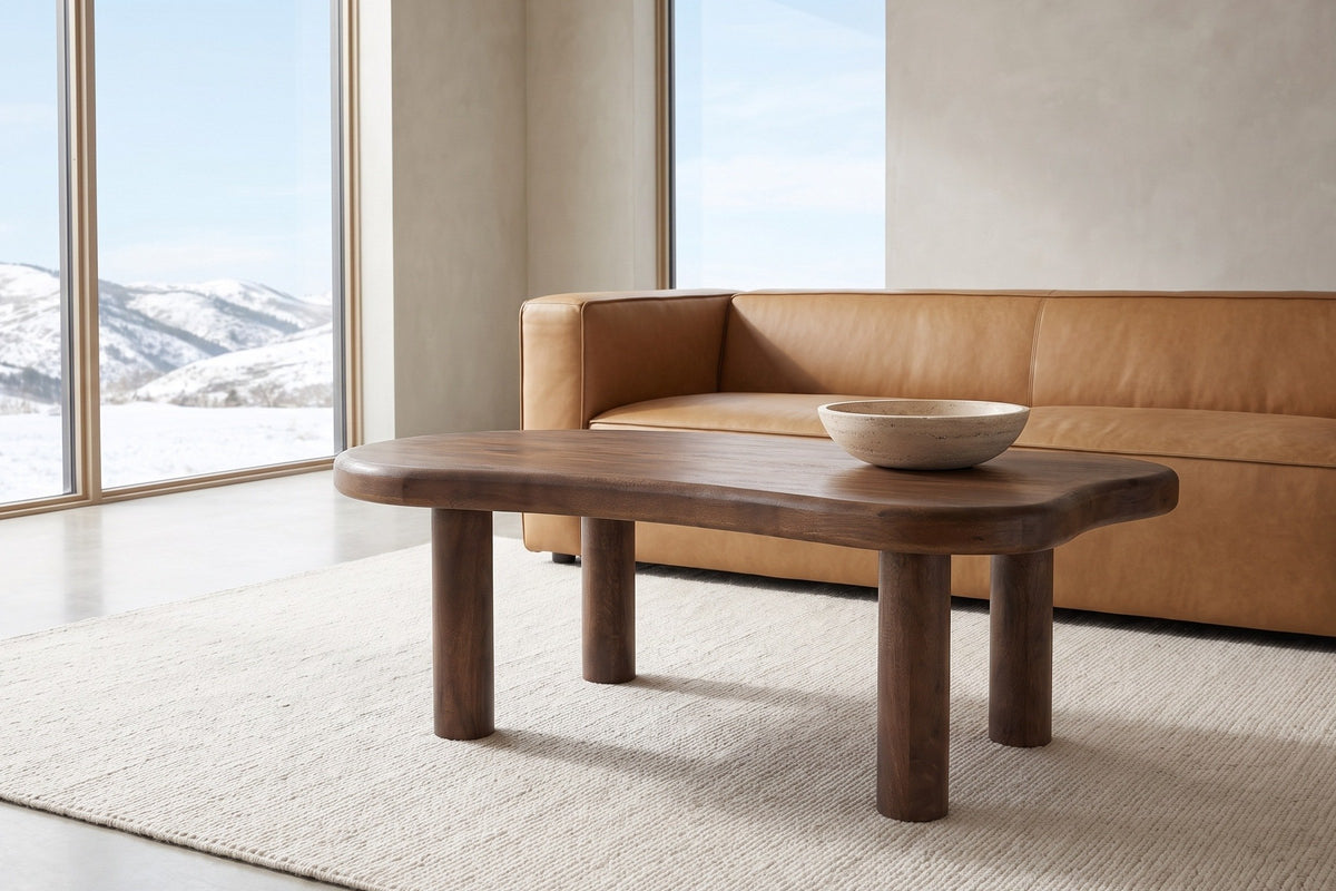 Bagnoregio coffee table in dark walnut in front of a camel leather sofa in a Calgary living room