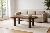 Bagnoregio coffee table in dark walnut before a sand linen sofa in a Montreal living room