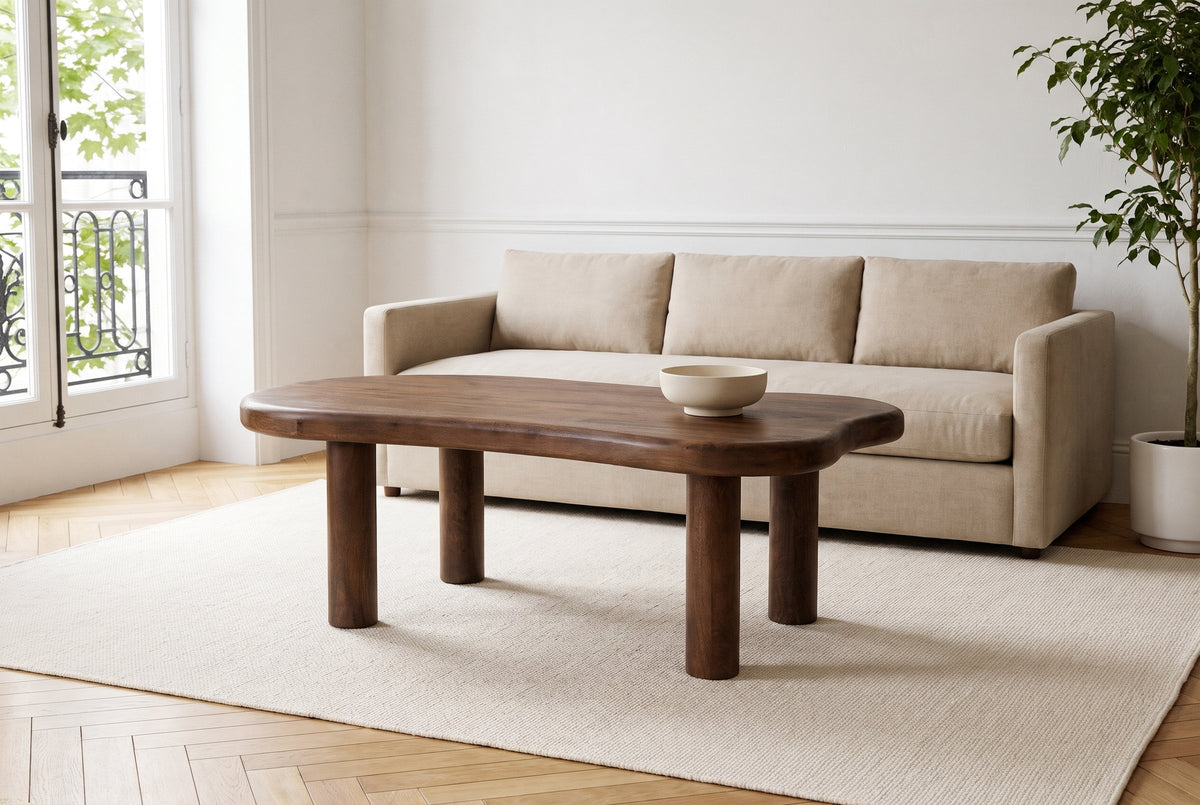 Bagnoregio coffee table in dark walnut before a sand linen sofa in a Montreal living room