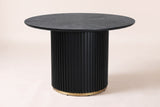 Bardolino dining table in black, side view: a thin round top with a sunburst of wood grain