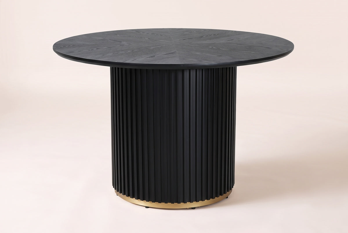 Bardolino dining table in black, side view: a thin round top with a sunburst of wood grain