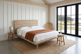 Bassiano bed in Light Driftwood in a bedroom in an Antigonish coastal barn, three-quarter view from the other foot corner