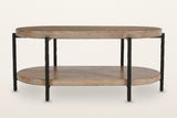 Bellano coffee table from the front: two oval tiers of solid mango wood on six hand-hammered black iron rods