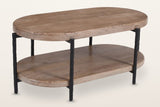 Bellano oval mango wood coffee table, three-quarter view from above on a warm white studio backdrop