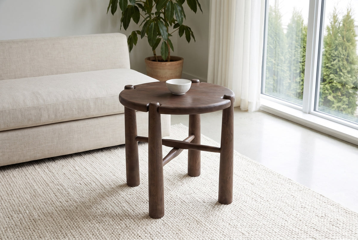 Bettona side table beside a linen sofa in a bright Vancouver living room, a small white bowl on its round top