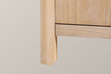 Close-up of a rounded natural solid pine corner post becoming a short leg under the bottom rail