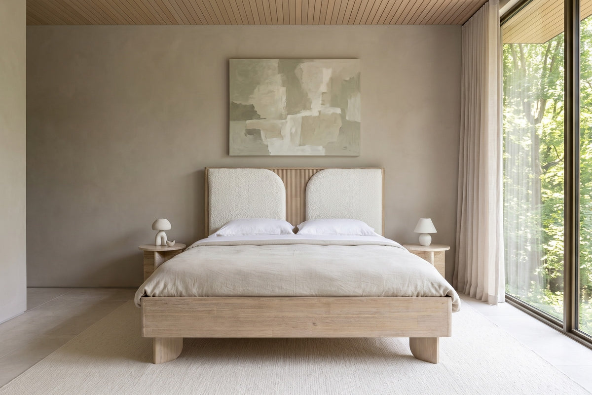 Front view of the Bienno bed in a bedroom in a Lawrence Park ravine house in Toronto, with greige limewash
