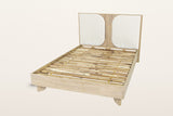 Bienno bed frame without a mattress on a warm white studio backdrop: the acacia slats inside the box rail