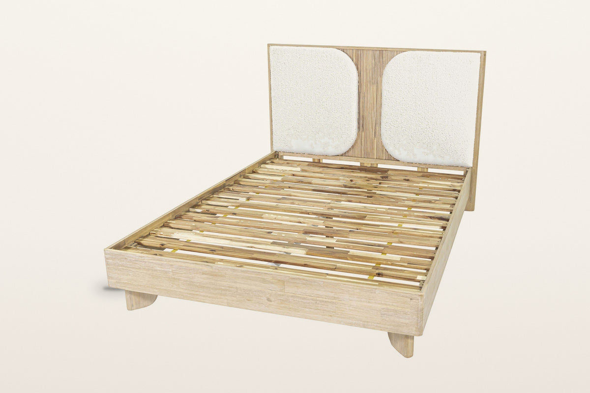 Bienno bed frame without a mattress on a warm white studio backdrop: the acacia slats inside the box rail