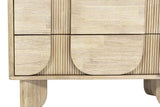 Close-up of the lower front of the Bienno chest in Sand Wash: the rounded bottoms of the pill panels, the fluted strips