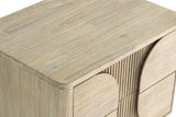 Close-up of the Bienno top corner in Sand Wash: the rounded corner, the brushed grain and the fluted front below